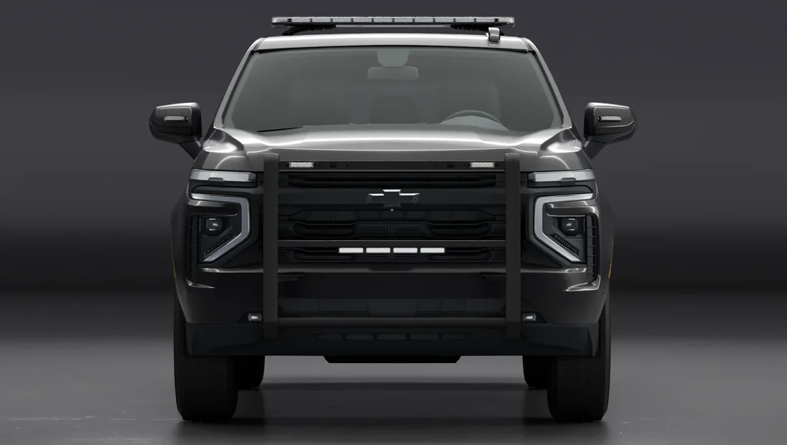 A Chevy Tahoe built with a Feniex roof bar, push bumper and mirror lights