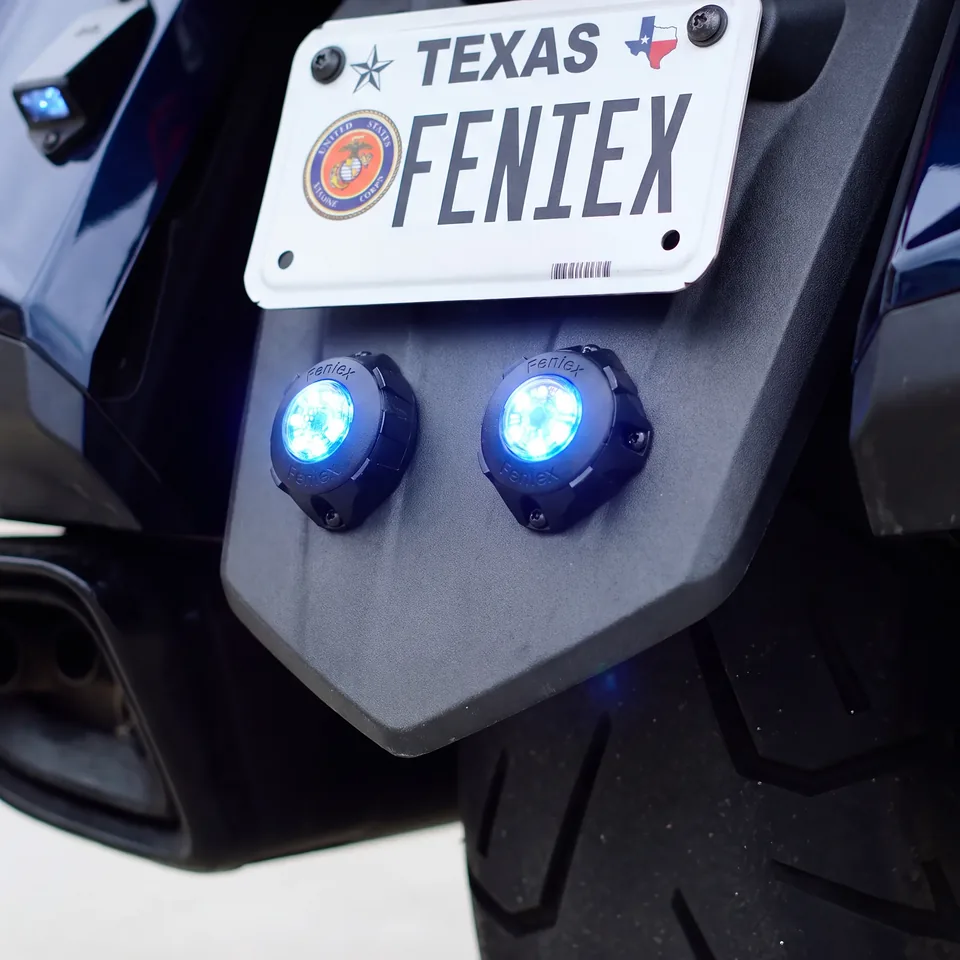 Two Cannon S lights lit blue on a push bumper