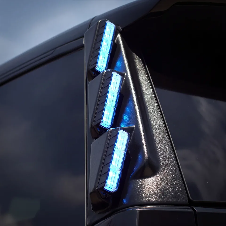 Fusion Pillar lights lit blue on a dark vehicle pillar