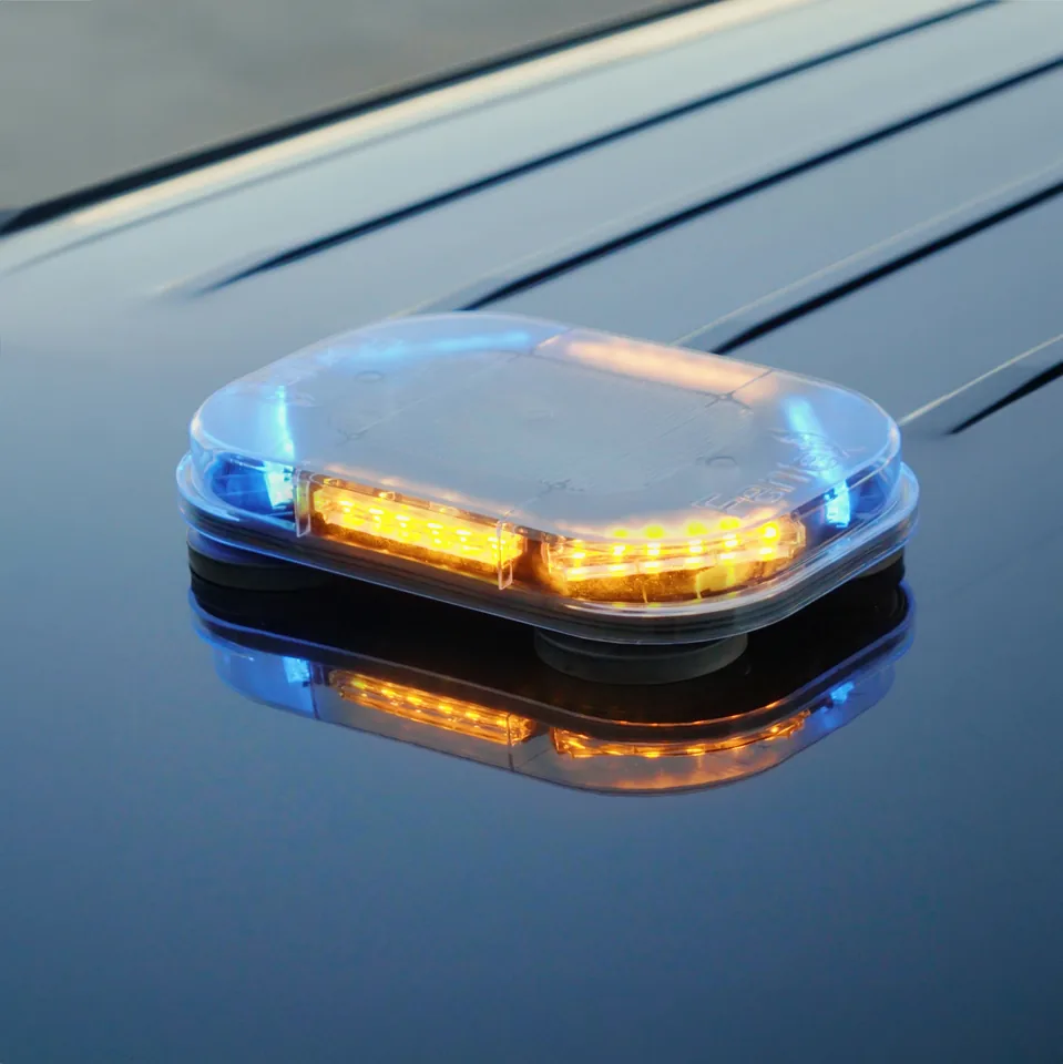 Quantum Mini 12 light bar lit amber and blue on a dark roof