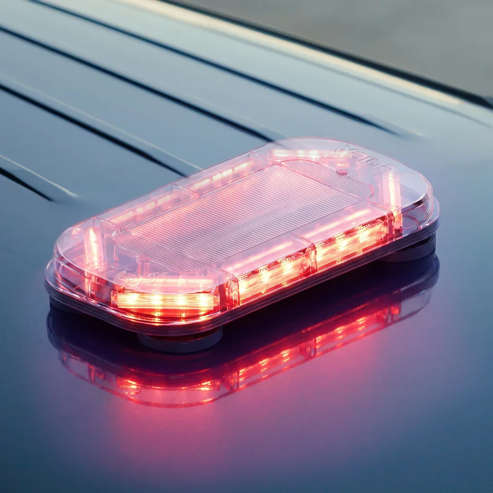 Quantum Mini 18 light bar lit red on a dark roof