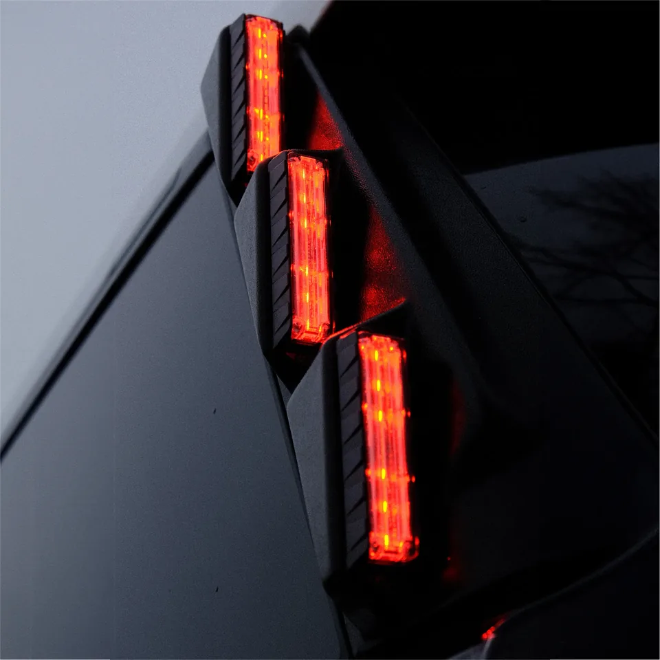 Quantum Pillar lights lit red on a vehicle pillar