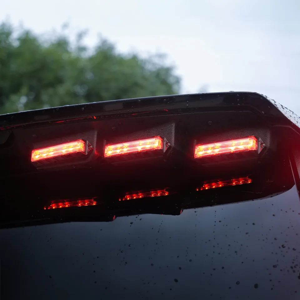 Quantum Spoiler lights lit red on a vehicle rear spoiler